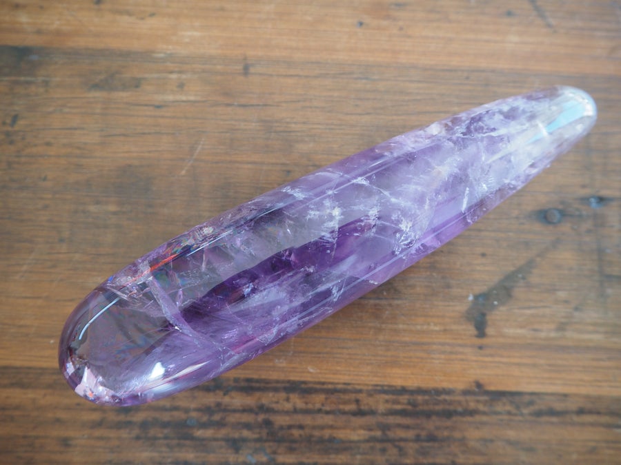 Amethyst Crystal Dildo On Wooden Background 