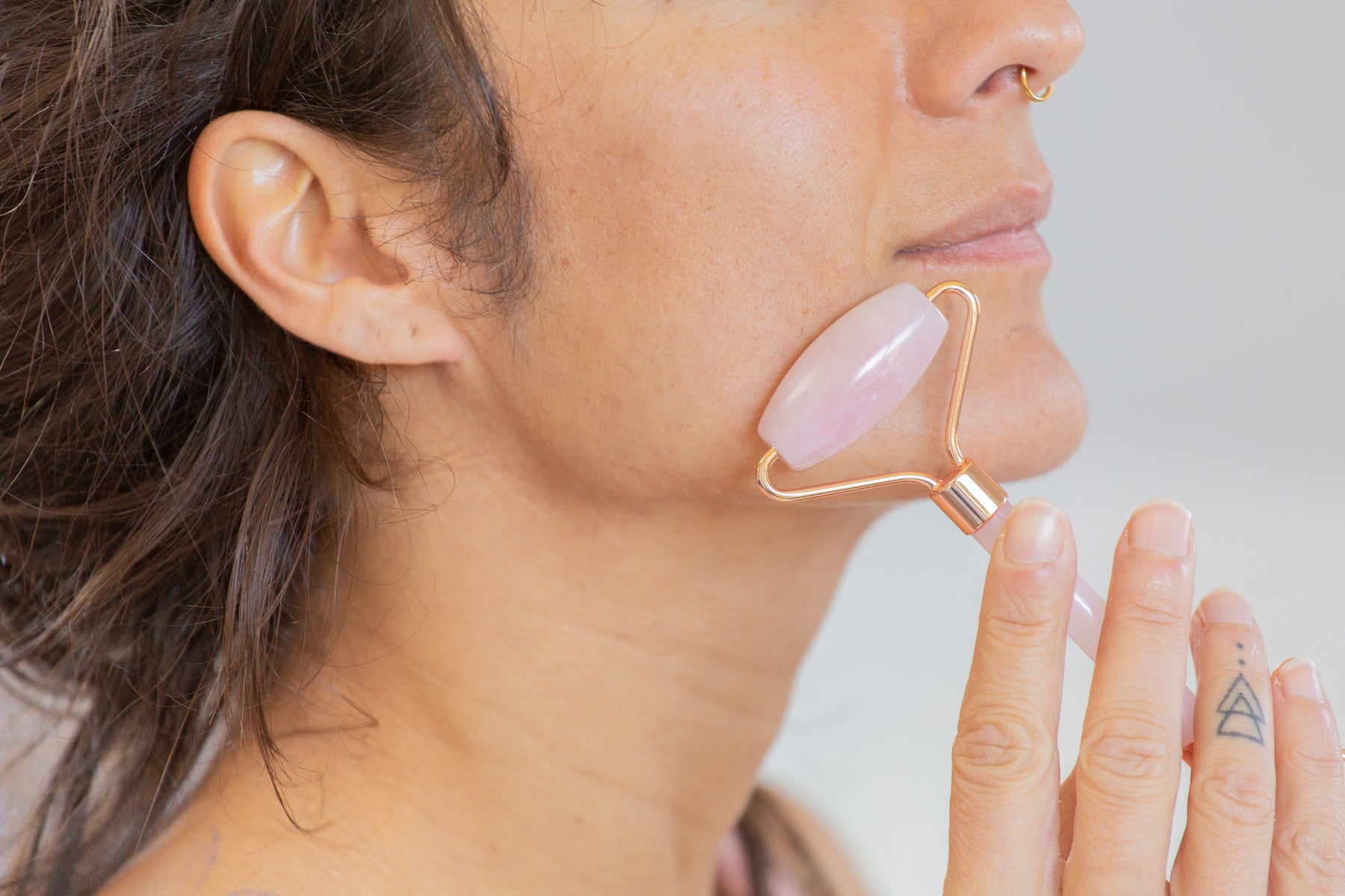 Rose Quartz Face Roller and Woman Jaw